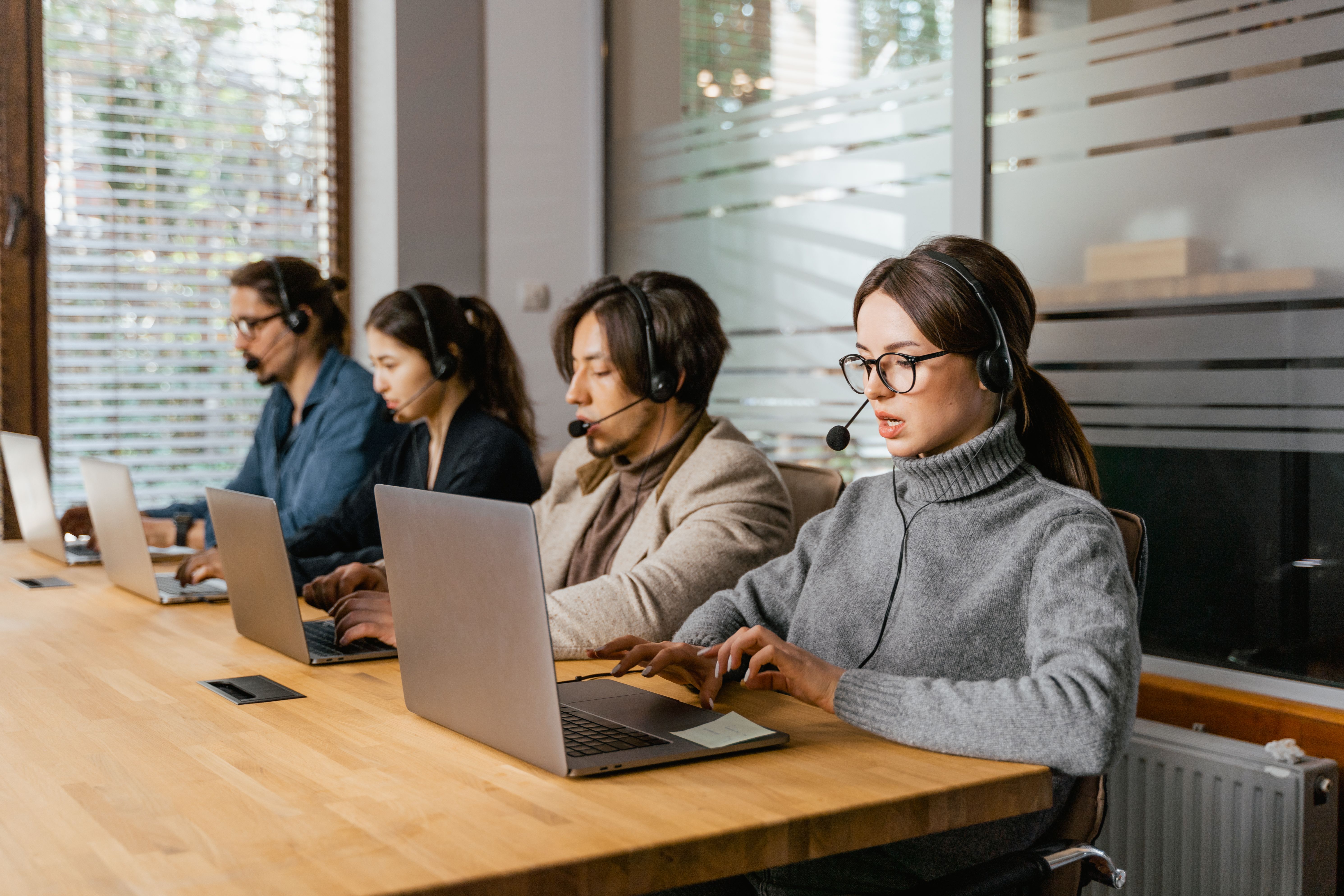 Customer service team working at desk